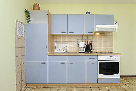 Ferienwohnung „Deich“ - Wohnzimmer mit integriertem Küchenbereich