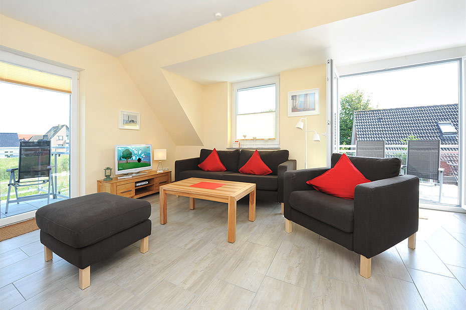 Ferienwohnung „Deichblick“ - Wohnzimmer mit integriertem Küchenbereich
