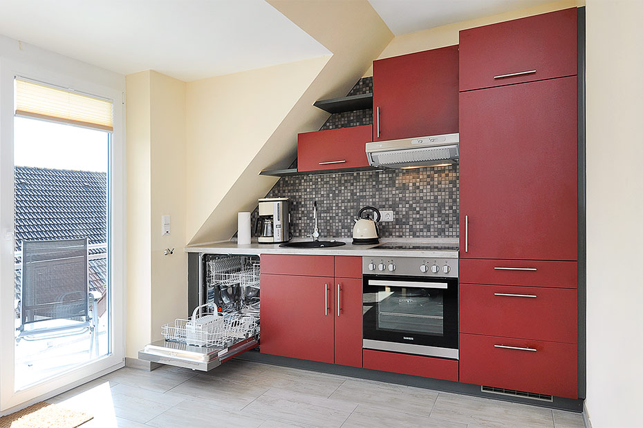 Ferienwohnung „Deichblick“ - Wohnzimmer mit integriertem Küchenbereich