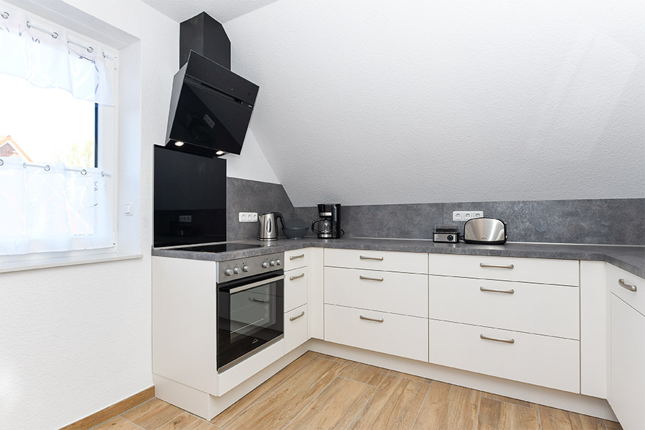 Ferienwohnung „Flut“ - Wohnzimmer mit integriertem Küchenbereich