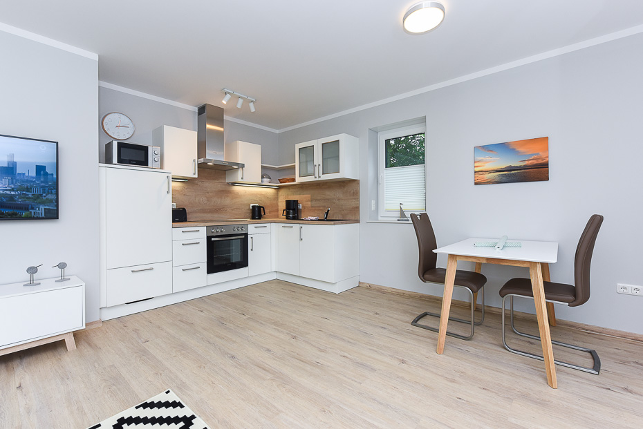 Ferienwohnung 14 - Wohnzimmer mit integriertem Küchenbereich