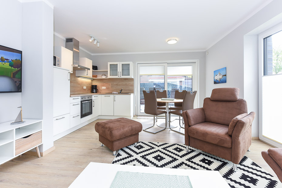 Ferienwohnung 15 - Wohnzimmer mit integriertem Küchenbereich