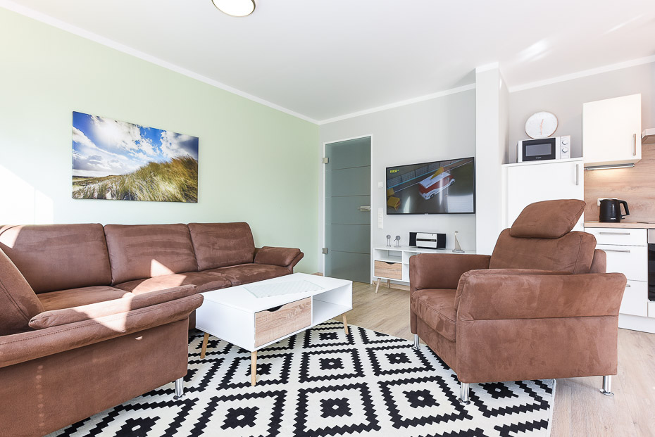 Ferienwohnung 15 - Wohnzimmer mit integriertem Küchenbereich