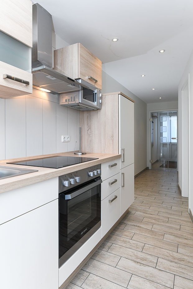 Ferienwohnung „Nordseekieker“ - Wohnzimmer mit integriertem Küchenbereich