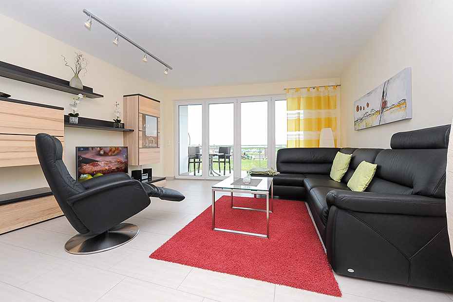 Ferienwohnung „Strandidyll“ - Wohnzimmer mit integriertem Küchenbereich