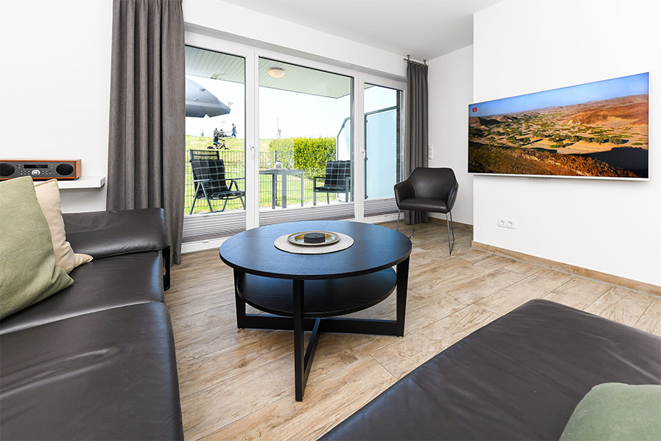 Ferienwohnung „Buhne 2“ - Wohnzimmer mit integriertem Küchenbereich