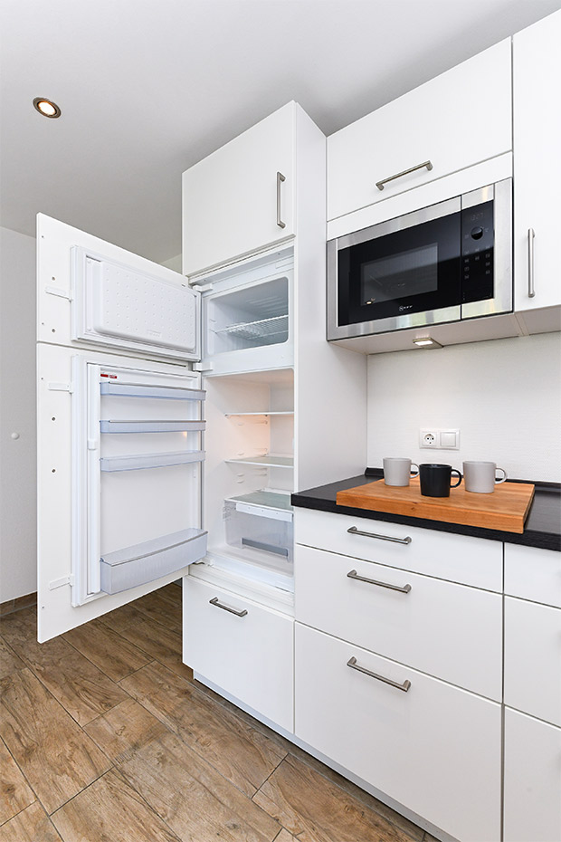 Ferienwohnung „Buhne 2“ - Wohnzimmer mit integriertem Küchenbereich