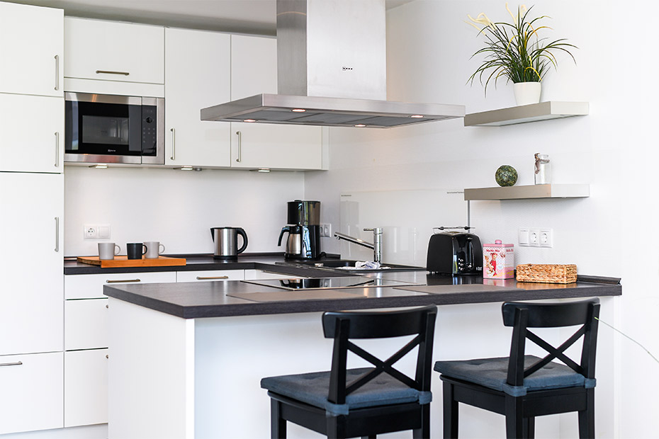 Ferienwohnung „Buhne 2“ - Wohnzimmer mit integriertem Küchenbereich