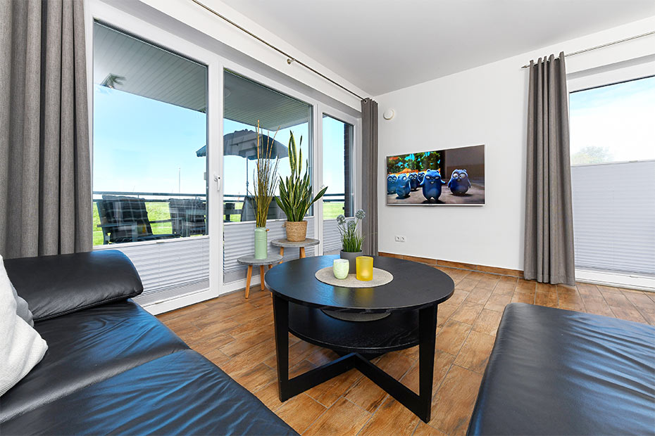 Ferienwohnung „Buhne 6“ - Wohnzimmer mit integriertem Küchenbereich