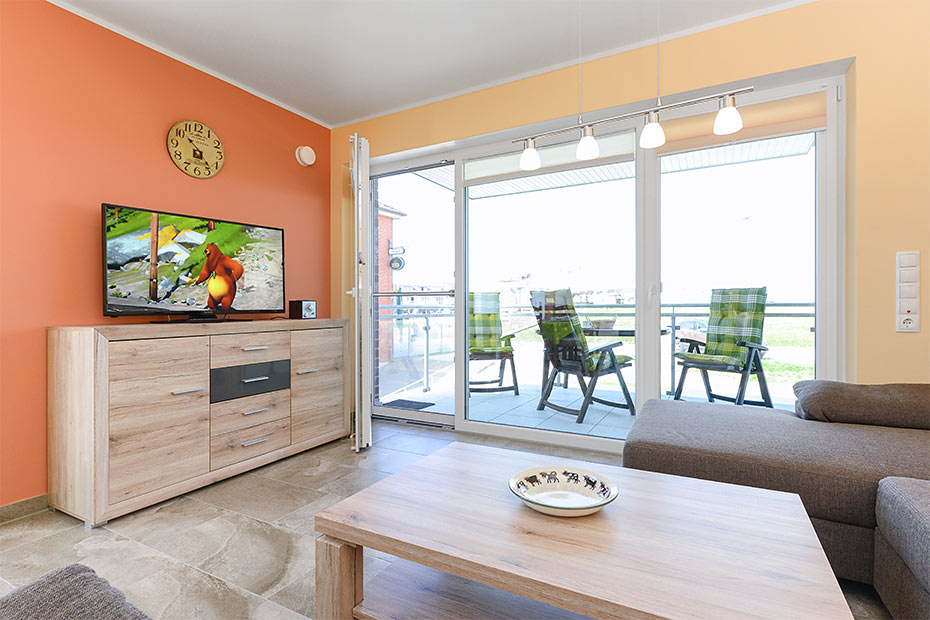 Ferienwohnung „Molenfeuer“ - Wohnzimmer mit integriertem Küchenbereich