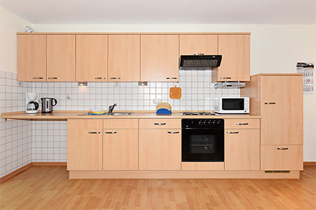 Ferienwohnung 1 - Wohnzimmer mit integriertem Küchenbereich