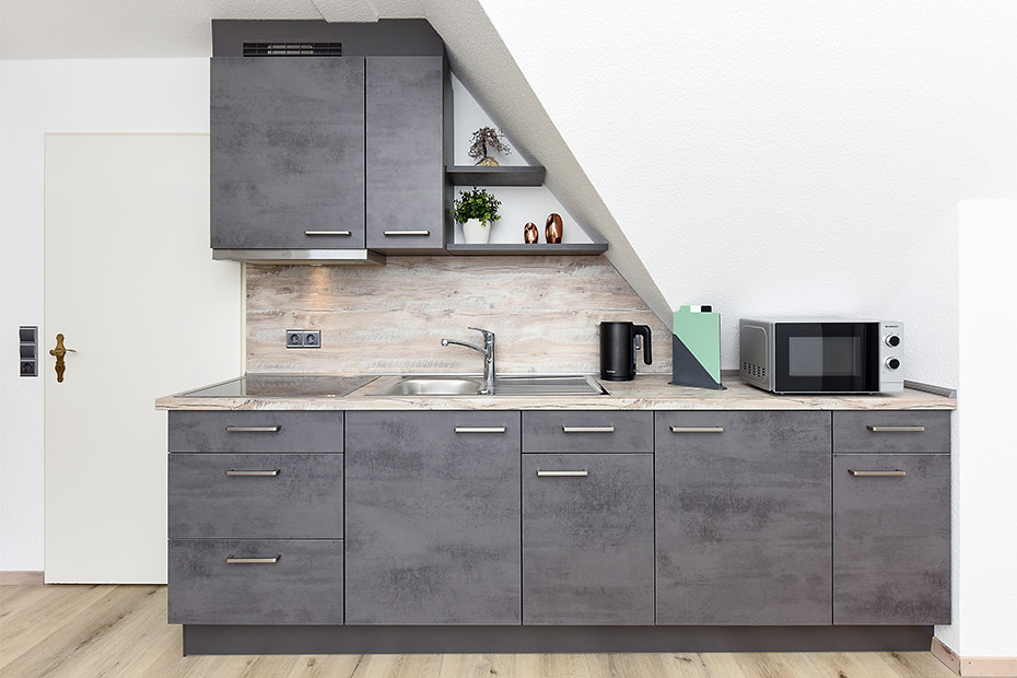 Ferienwohnung 2 - Wohnzimmer mit integriertem Küchenbereich