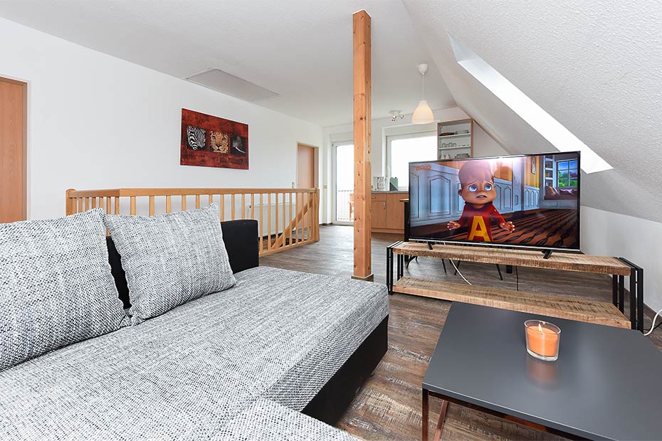 Ferienwohnung 3 - Wohnzimmer mit integriertem Küchenbereich