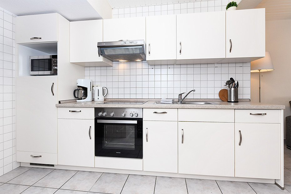 Ferienwohnung „Langeoog“ - Wohnzimmer mit integriertem Küchenbereich