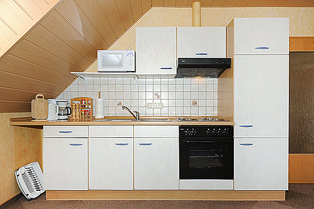 Ferienwohnung „Nord“ - Wohnzimmer mit integriertem Küchenbereich