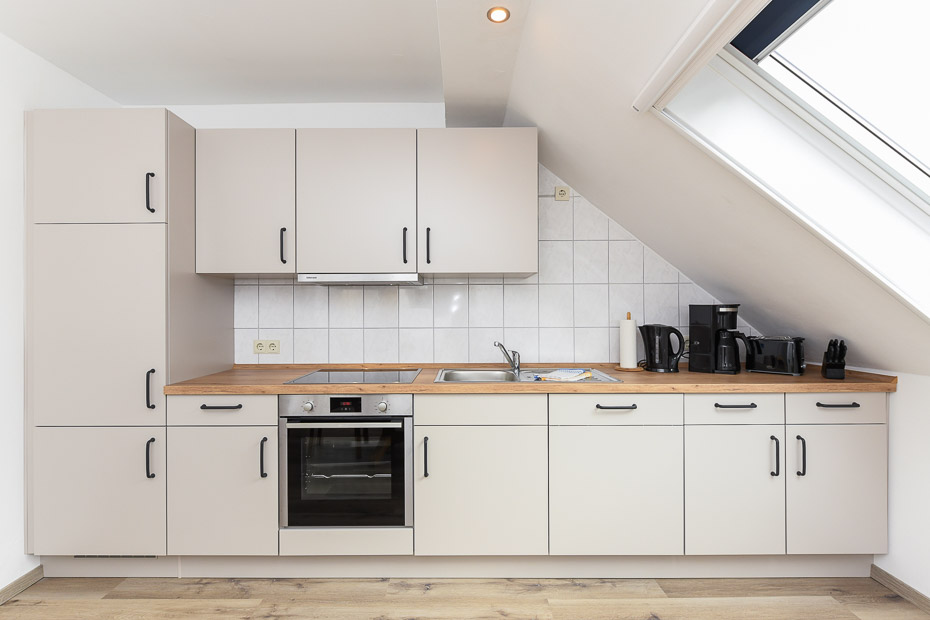 Ferienwohnung „Osthörn“ - Wohnzimmer mit integriertem Küchenbereich