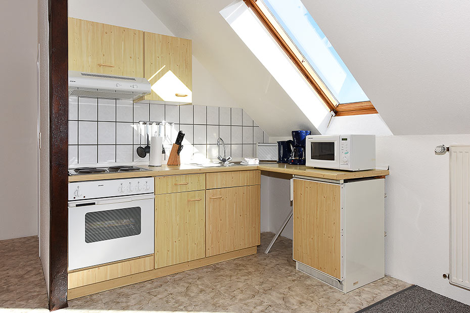 Ferienwohnung „Spiekeroog“ - Wohnzimmer mit integriertem Küchenbereich