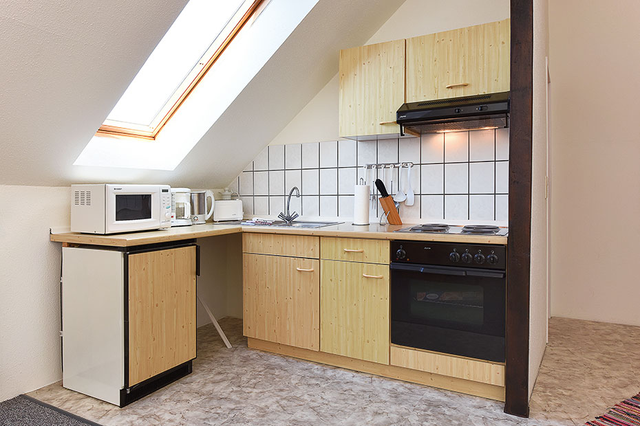 Ferienwohnung „Wangerooge“ - Wohnzimmer mit integriertem Küchenbereich