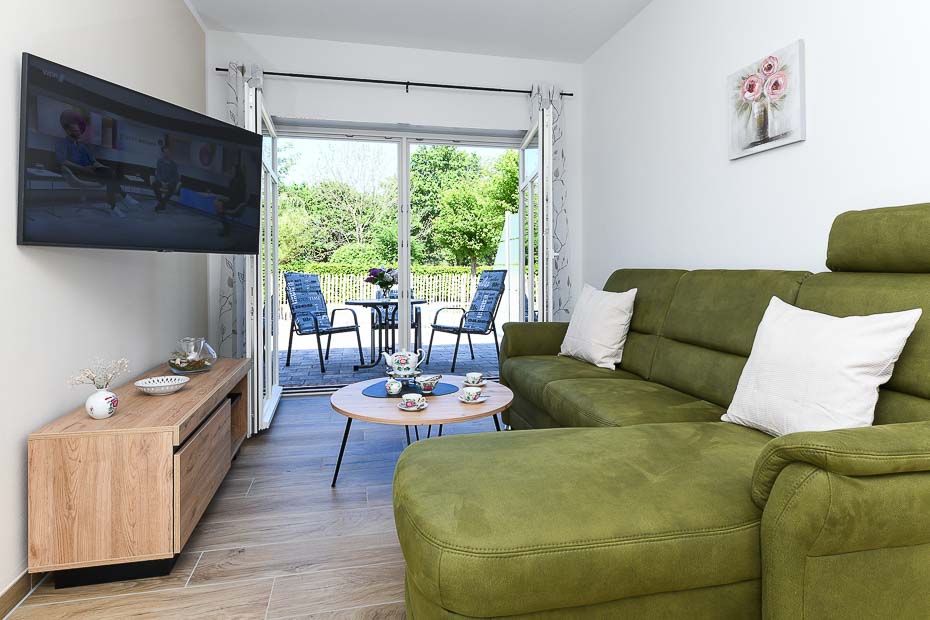 Ferienwohnung „Teetied“ - Wohnzimmer mit integriertem Küchenbereich