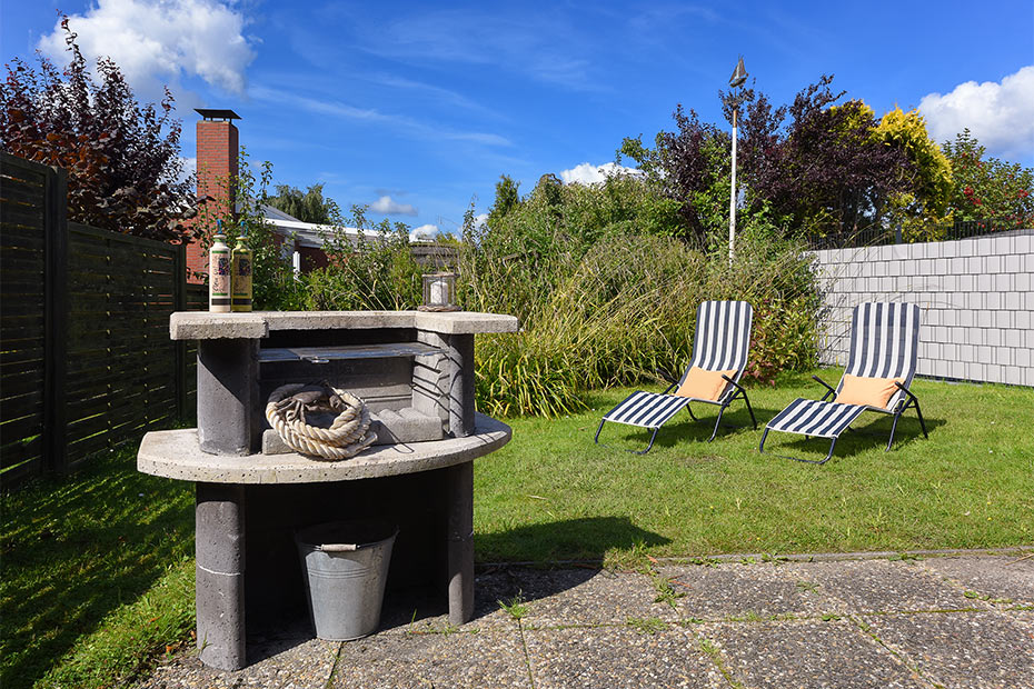 Ferienhaus „Jupiter“ - Garten mit Terrasse