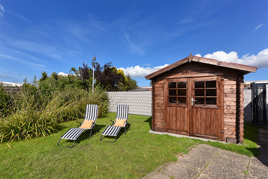 Ferienhaus „Jupiter“ - Garten mit Terrasse
