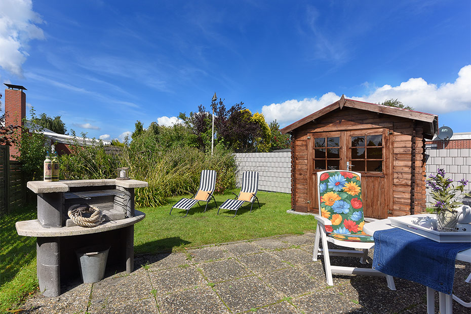 Ferienhaus „Jupiter“ - Garten mit Terrasse