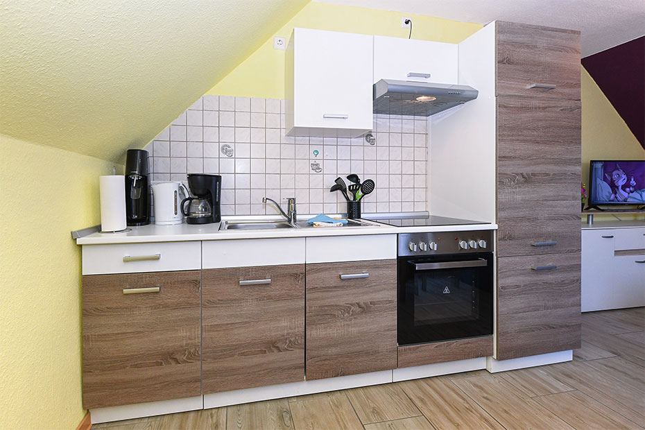 Ferienwohnung „Haus Seemöwe“ - Wohnraum mit integrierter Küche
