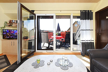 Ferienwohnung - Wohnraum und Esszimmer