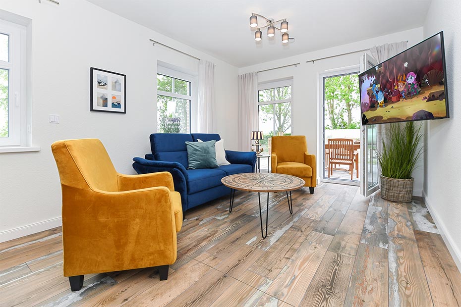 Ferienwohnung „Hühnerstall“ - Wohnzimmer mit Essplatz und integrierter Küche