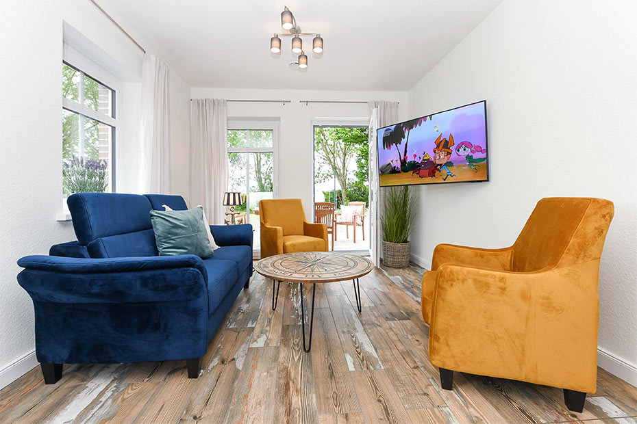 Ferienwohnung „Hühnerstall“ - Wohnzimmer mit Essplatz und integrierter Küche