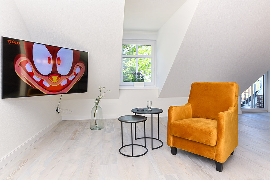 Ferienwohnung „Taubenschlag“ - Wohnzimmer mit Essplatz und integrierter Küche