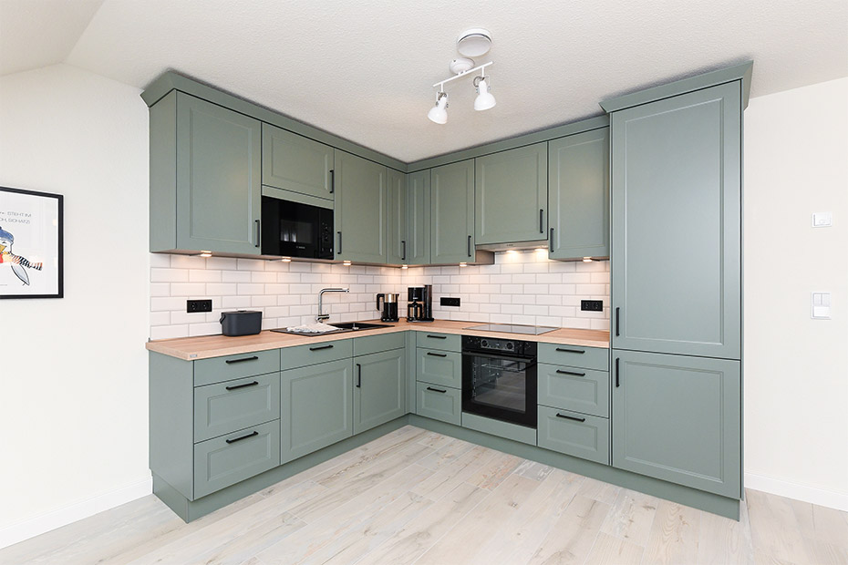 Ferienwohnung „Taubenschlag“ - Wohnzimmer mit Essplatz und integrierter Küche