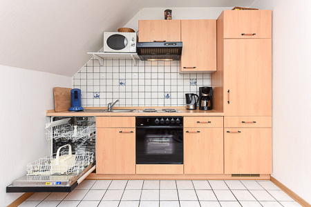 Ferienwohnung „Langeoog“ - Wohnzimmer mit integriertem Küchenbereich