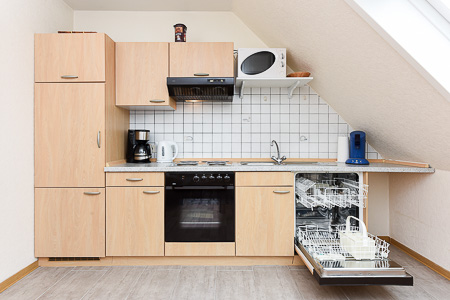 Ferienwohnung „Spiekeroog“ - Wohnzimmer mit integriertem Küchenbereich