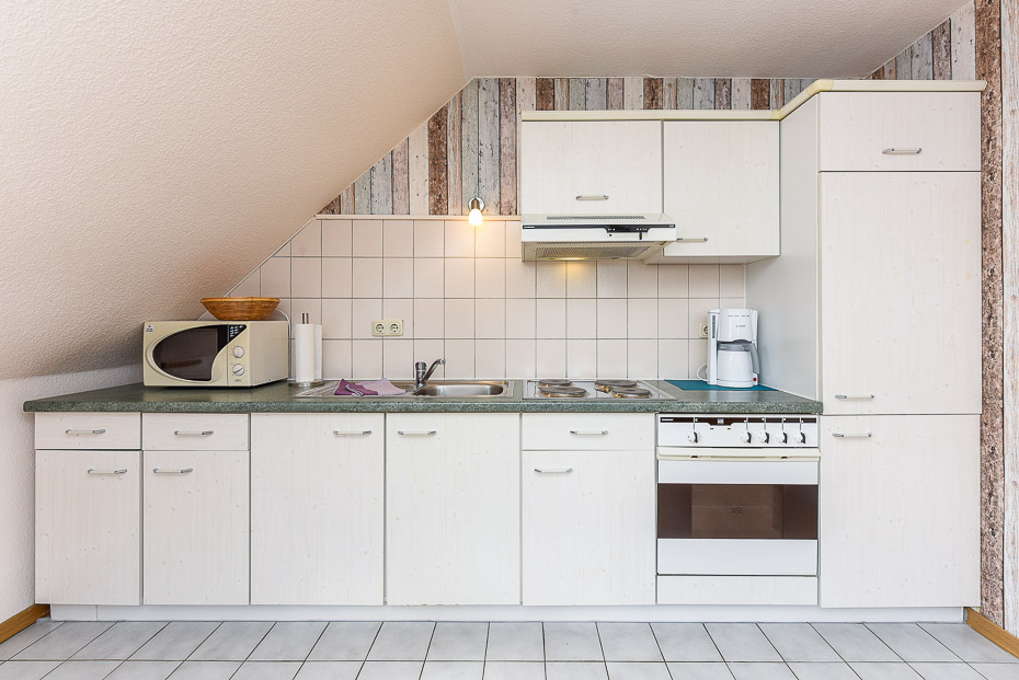 Ferienwohnung 1 - Wohnzimmer mit integriertem Küchenbereich