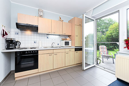 Ferienwohnung <span style='display:none'> </span> - Wohnzimmer mit integriertem Küchenbereich