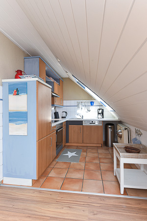 Ferienwohnung „Strandläufer“ - Wohnzimmer mit integriertem Küchenbereich