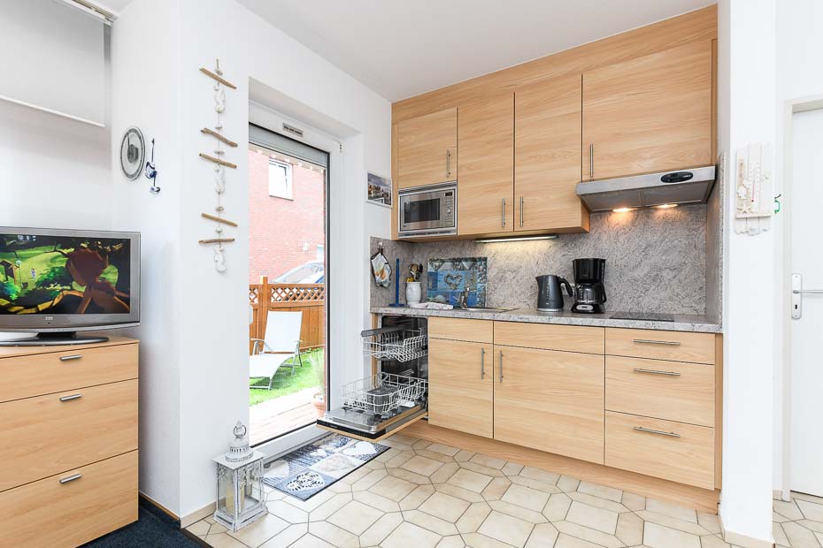 Ferienwohnung „Norderney“ - Wohnzimmer mit integriertem Küchenbereich