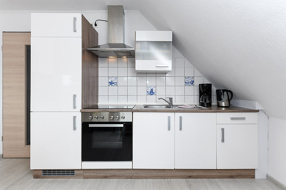 Ferienwohnung „Haus Antares“ - Wohnzimmer mit integriertem Küchenbereich