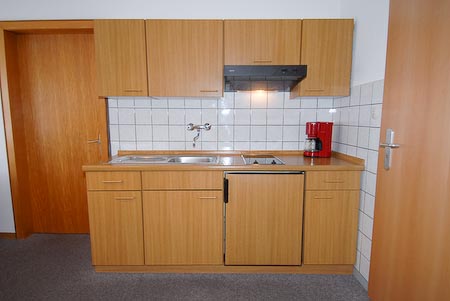 Ferienwohnung 5 - Wohnzimmer mit integriertem Küchenbereich