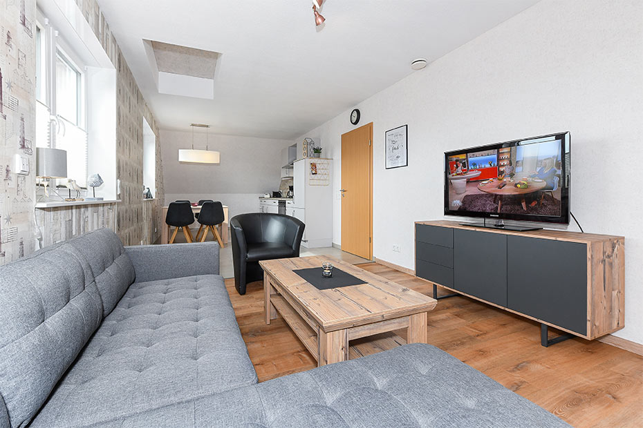 Ferienwohnung - Wohnzimmer mit integriertem Küchenbereich