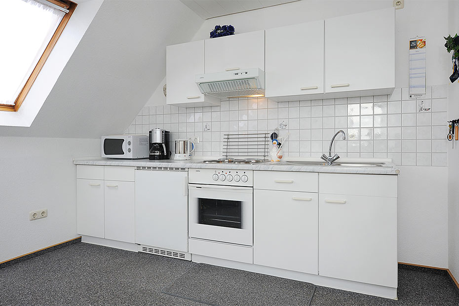 Ferienwohnung „Sonnenaufgang“ - Wohnzimmer mit integriertem Küchenbereich