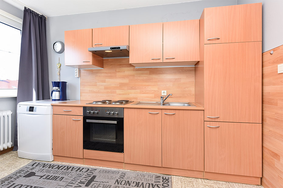 Ferienwohnung „Wind“ - Wohnzimmer mit integriertem Küchenbereich