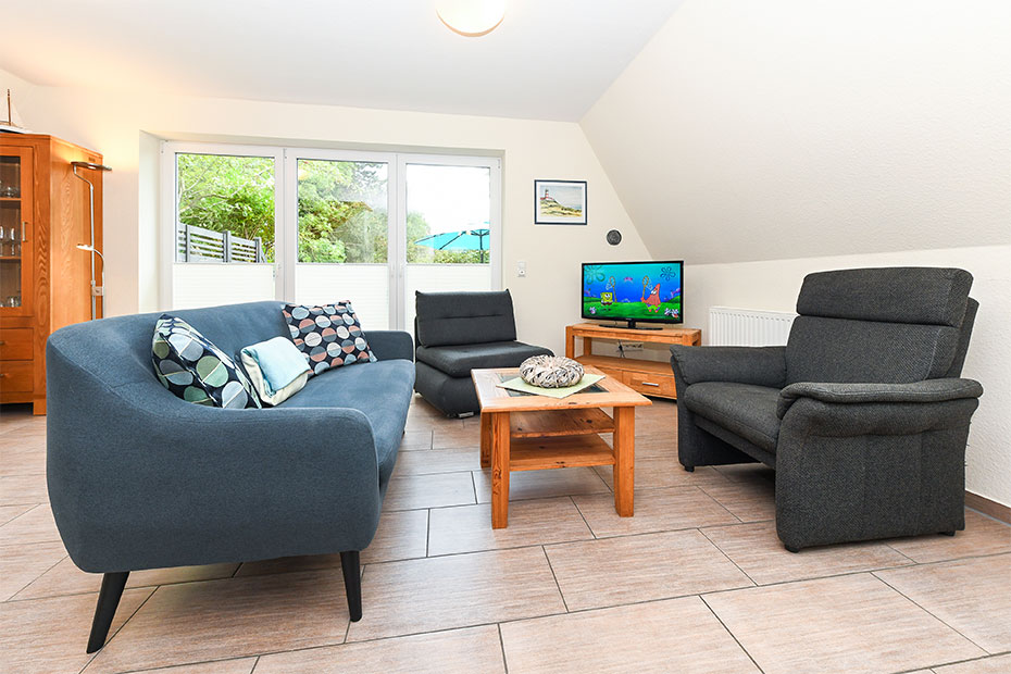 Ferienhaus „Nixe“ - Wohnzimmer mit integriertem Küchenbereich