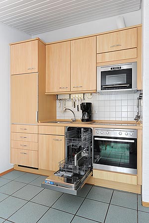 Ferienhaus „Nordseeluft“ - Wohnzimmer mit integriertem Küchenbereich