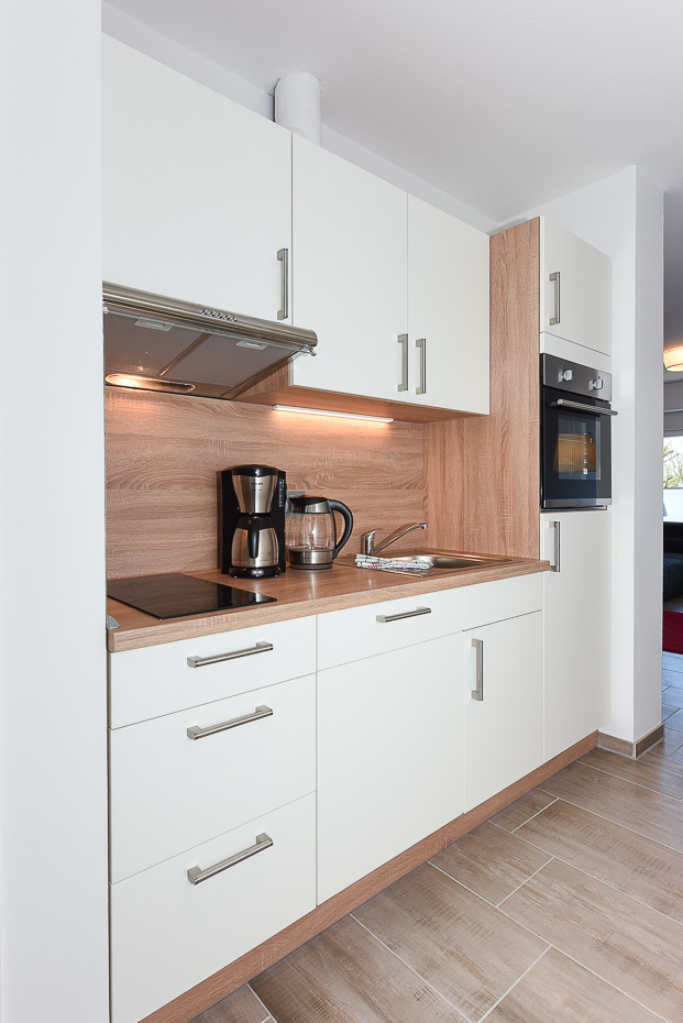 Ferienwohnung „Baltrum“ - Wohnzimmer mit integriertem Küchenbereich