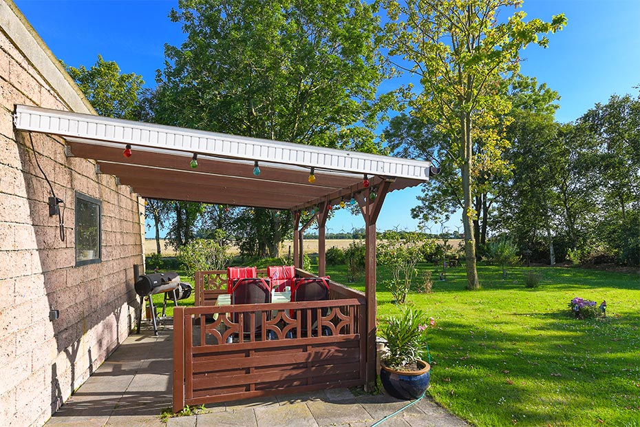 Ferienwohnung „Seestern“ - Außensicht mit überdachte Terrasse