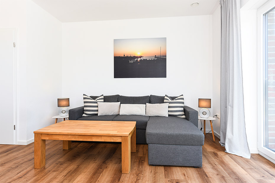 Ferienhaus „Küstenhäuschen“ - Wohnzimmer mit Essplatz und integrierter Küche