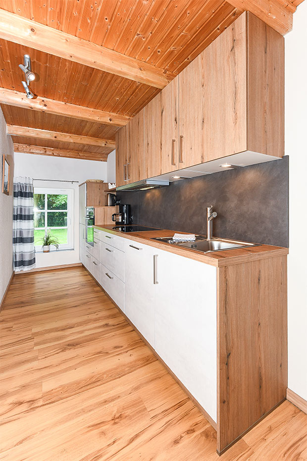 Ferienwohnung „Melkstall“ - Wohnzimmer mit integriertem Küchenbereich