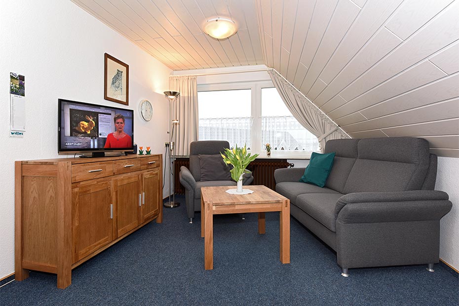 Ferienwohnung „Wangerooge“ - Wohnzimmer mit integriertem Küchenbereich